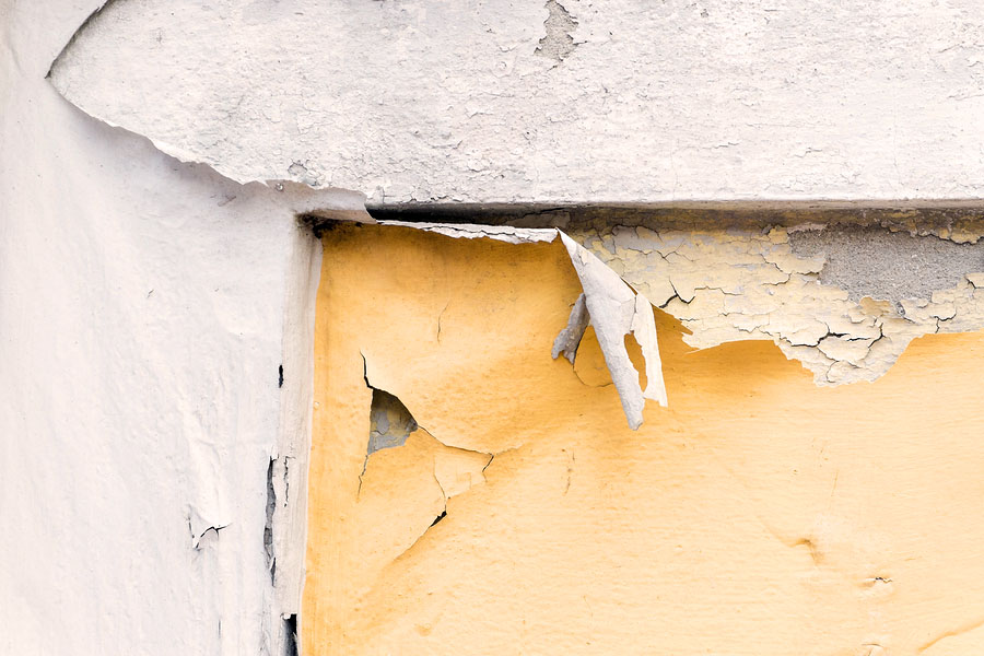 Scraping chipped paint home exterior painting process in Arizona